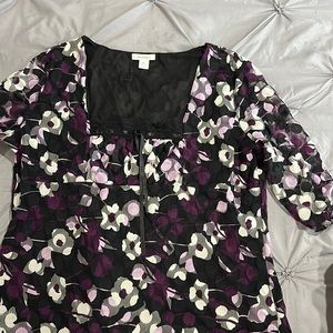 XL purple flower print on a black background top. SS